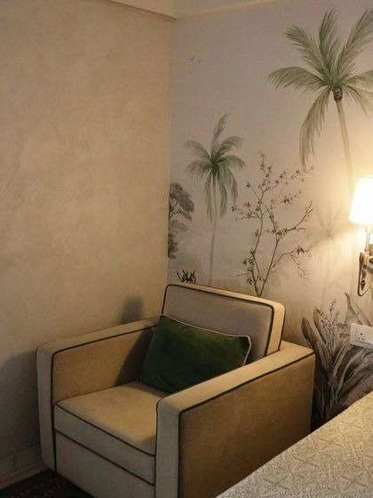 Here, my "whispering willow" wallpaper brings the untamed outdoors into a cozy corner. The design features subtle textures and a muted palette, creating an accent wall that feels both organic and sophisticated.