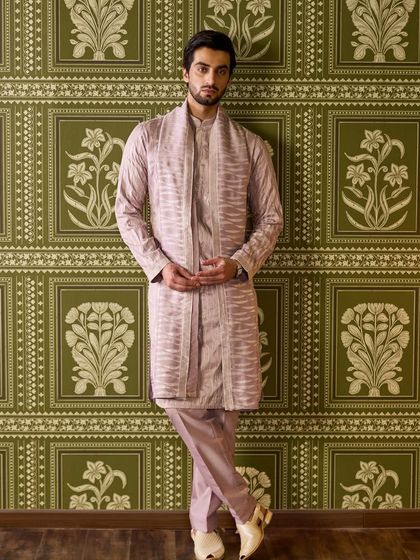 The full-length view of the mauve kurta set showcases its elegant drape and timeless silhouette. It's a perfect example of quiet luxury.