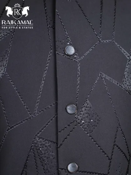 Another detail shot of the buttons and geometric beadwork on the black Jodhpuri.