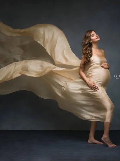 A vision in gold. Using a long, flowing piece of golden silk, we create a sense of majestic movement and power in this stunning fine-art portrait.