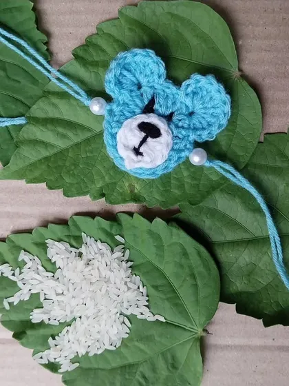 A cute blue bear-faced rakhi for the younger brothers.