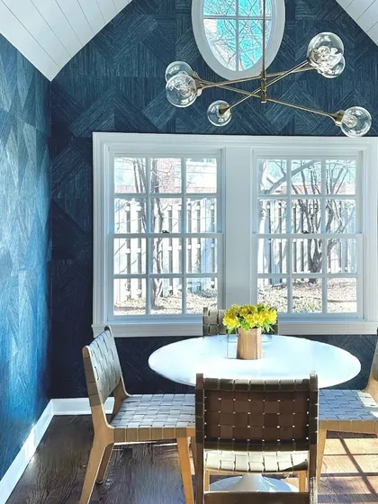 No Monday blues here. This charming breakfast nook is wrapped in the Arrowroot Inlay collection from Phillip Jeffries in a denim hue. The geometric pattern adds texture and character to the cozy space.