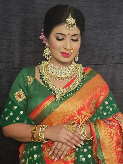 A beautiful shot of the bride with her eyes closed, showcasing the soft and blended eyeshadow work.