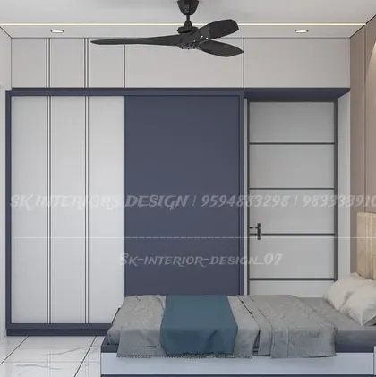 A duplicate of image 36, this bedroom showcases a modern sliding wardrobe in a striking blue and white combination, perfect for a contemporary home.