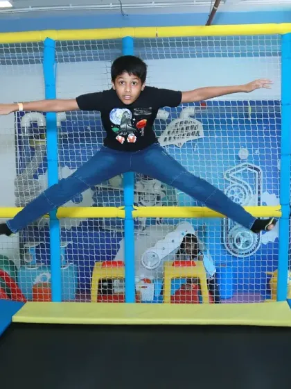A boy captured mid-air while jumping on a trampoline at a birthday party. I love freezing these moments of pure energy and fun.