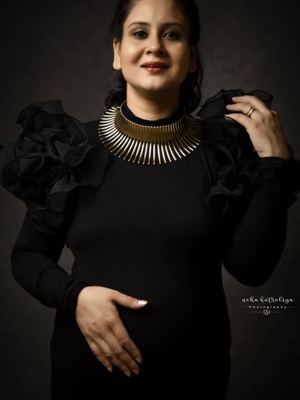 A closer look at the details. The ruffled sleeves and statement necklace were key parts of this powerful, self-styled look.