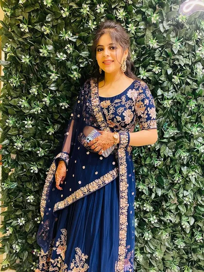 A classic navy blue lehenga with beautiful gold floral embroidery. This is an elegant and timeless rental piece for any wedding guest.