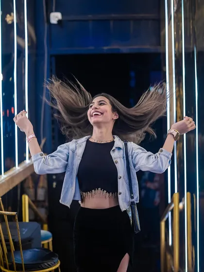 A guest showing off her hair flip. The energy at my parties is all about freedom and self-expression.