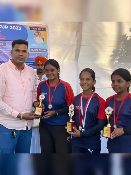The winning girls' team receiving their trophies at the Drona Cup 2023. Team events build camaraderie and competitive spirit.