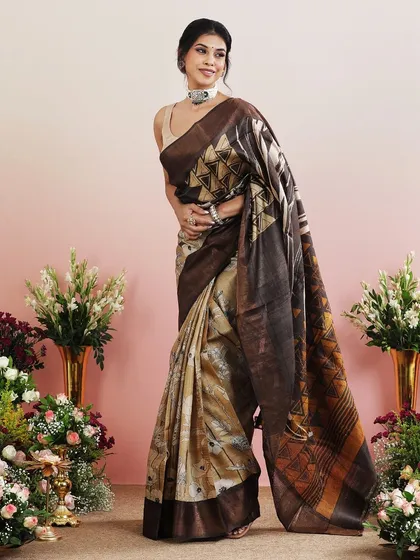 The elegant drape of this printed saree is captured beautifully in this shot.