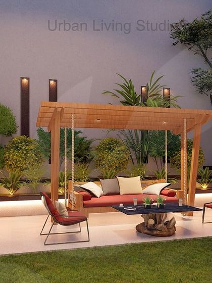 A cozy corner within the expansive Aligarh property. This render shows a seating area with a wooden pergola and swing, surrounded by lush greenery, demonstrating how we create intimate spaces even in large landscapes.