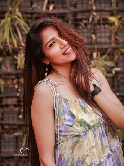 Sometimes the most authentic portraits happen in the simplest moments. A genuine smile, the wind in her hair, and the warmth of the golden hour create a feeling of effortless joy. This is about capturing the vibe that makes you, you.