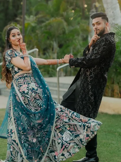 This series of photos captures a stylish couple during their Sangeet. From a romantic forehead kiss to playful poses, these shots showcase their beautiful coordinated outfits and happy connection.
