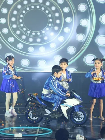 Our youngest performers stealing the show. This moment from our annual showcase highlights the confidence and joy our kids' dance classes inspire, complete with fun props and a big stage.