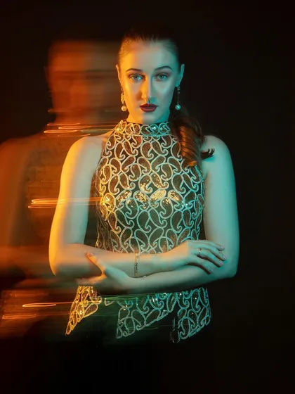 A powerful and confident pose. The ghosting effect of the long exposure adds a layer of mystery and intrigue.