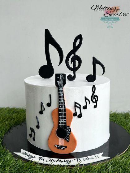 A different angle of the music-themed cake, showcasing the 3D fondant music notes on top. The cake inside is our popular Lotus Biscoff flavor.