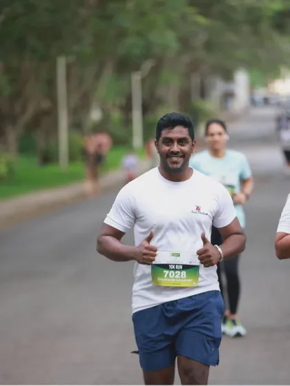 A confident smile from me during the Mysuru Run. I practice what I preach and lead my team from the front.
