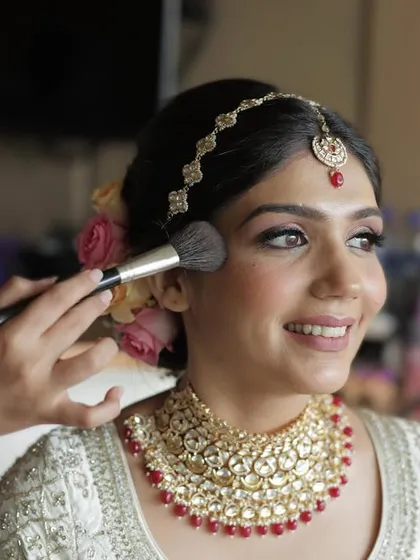 A close-up of the makeup process for Kanika. A light touch of blush and perfectly defined eyes create a look that is both traditional and modern for the contemporary bride.
