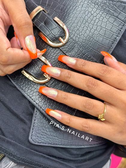 Fresh orange tips with a touch of sparkle. A bright and fun look.