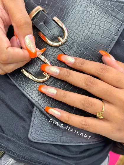 Fresh orange tips with a touch of sparkle. A bright and fun look.