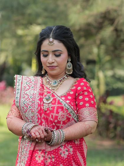 A beautiful, eyes-closed shot of the bride, showcasing her soft and blended eye makeup. The look is serene and timeless.