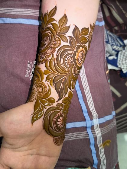 A close-up of a fresh floral design on the arm.