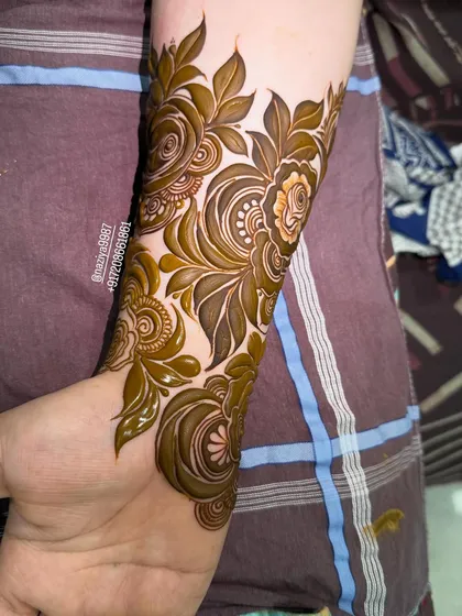 A close-up of a fresh floral design on the arm.