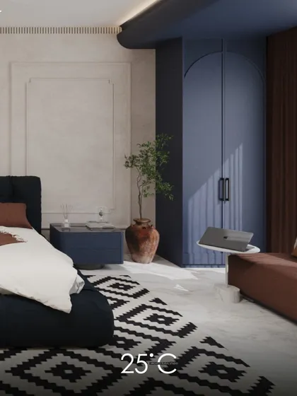 A bedroom design that uses a bold and contemporary color scheme of navy blue and terracotta. The arched wardrobe doors and geometric rug add personality and modern flair to the space.