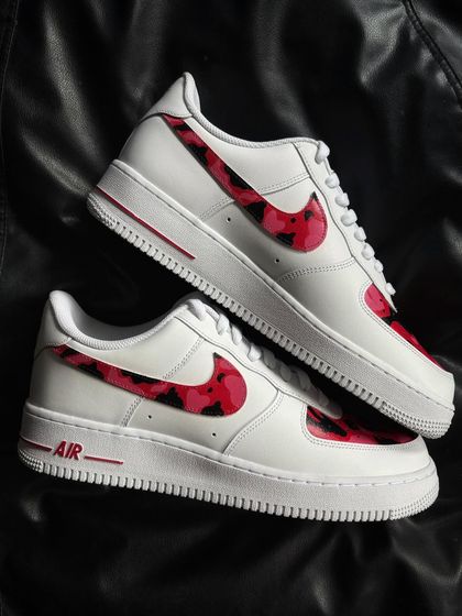 A top-down view of the red camo custom sneakers.