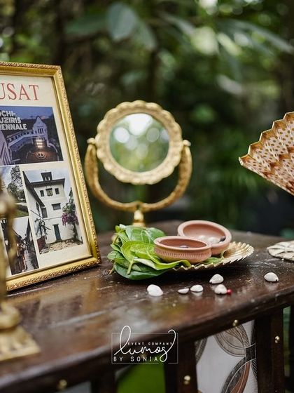 A corner dedicated to the couple's love for Cochin, featuring a vintage mirror, fan, and other traditional elements.
