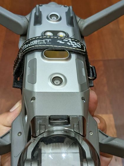 A bottom view of the Mavic 2 Pro, showing the secure mounting of the FPV equipment. This highlights the technical aspect and attention to detail that goes into my specialized drone work.