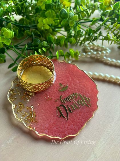 Light up your Diwali with handcrafted elegance. This "Happy Diwali" resin tea light holder in a beautiful pink shade is a perfect addition to your festive decor.
