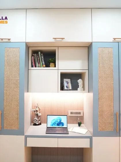 This bedroom unit combines a study desk with full-height wardrobes featuring beautiful cane webbing. It's a perfect example of a stylish and space-efficient design.
