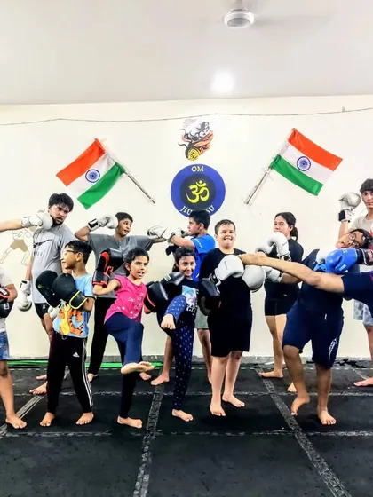 The energy in our Muay Thai and boxing classes is contagious. This group of kids is ready for action, showing off their stances and having fun while learning a serious martial art.