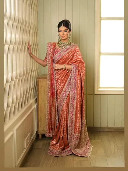 The elegance of this drape is evident in how it falls, creating a silhouette that is both traditional and incredibly chic.