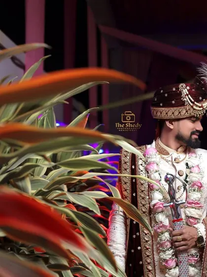 An intimate portrait of the bride and groom sharing a quiet moment together amidst the wedding celebrations.