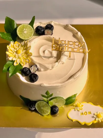 My most popular creation, the signature Italian Lemon & Blueberry cake. I offer many design variations, all featuring fresh blueberries, zesty lime, and smooth buttercream.