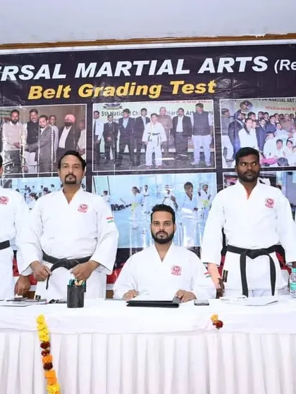 Our team of black belt instructors and examiners, led by Director and Chief Coach Satish Kumar, ready to begin a belt grading test. We ensure every test is fair and upholds high standards.