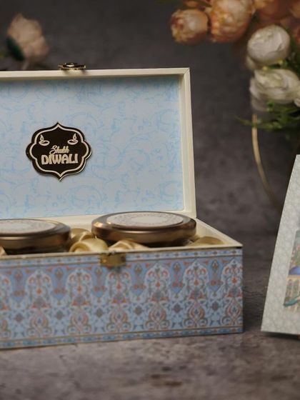 A simple yet elegant dry fruit box for Diwali. The pastel blue color and minimalist design make it a classy choice for corporate or personal gifting.