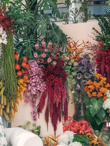 Another angle of the 'Garden of Gaia' setup, showing the depth and richness of the floral arrangements.