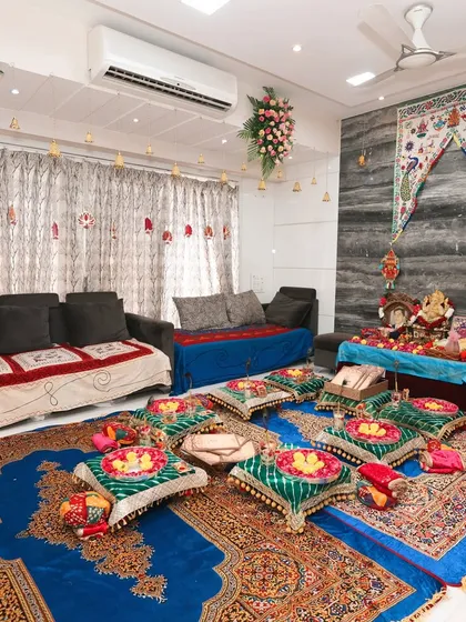 Another angle of the Lagan Lakhwanu setup, showing how all the elements come together in a home setting. The floral arrangements on the ceiling and the traditional textiles create a complete festive transformation of the living space.