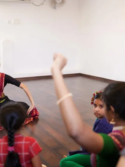 Teaching a group of young learners. I use engaging methods to explain complex movements, ensuring even the youngest students grasp the fundamentals of Bharatanatyam.