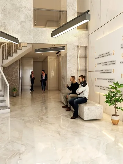 A 3D render of the main lobby for the upcoming 'AURA - Sky Tower' in Nashik. The design for this 12-story commercial building features a double-height entrance, marble-clad surfaces, and a clear directory system for a grand and welcoming first impression.