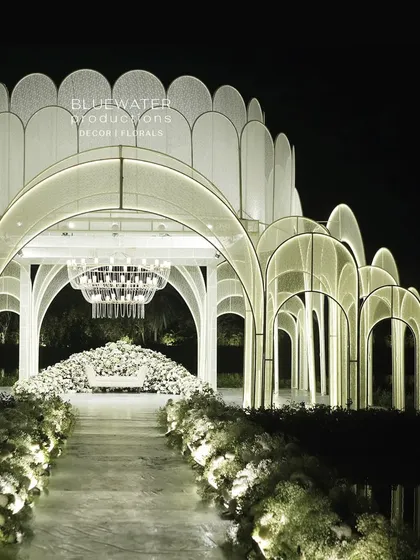 For this lakeside reception, we designed and built a floating palace. The entire structure, clad in delicate lace and illuminated from within, created a breathtaking, ethereal glow over the water.