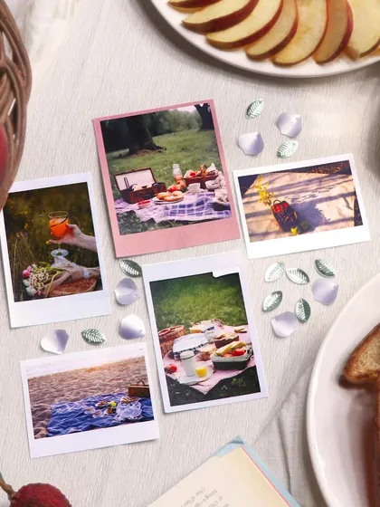 The polaroids and floral sequins add a touch of whimsy and dimension to your creations.