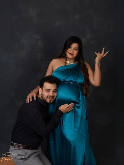 A fun and playful pose that shows off the couple's personality. The rich satin gown adds a touch of glamour to the shot.