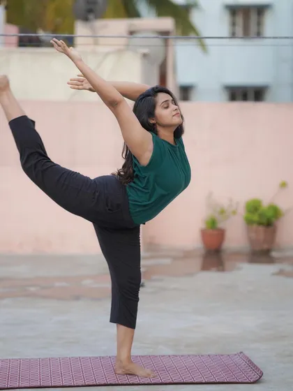 You will fall. You will wobble. The important part is to get your ass back up and try again. This Natarajasana, or Lord of the Dance pose, is a beautiful reminder to find grace even when you feel off-balance.