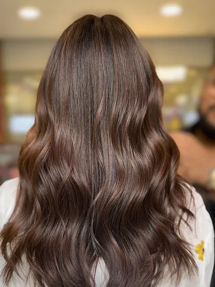 A close-up showing the rich, solid brown color with incredible shine. This look is classic, healthy, and proves that sometimes a simple, well-executed color is the most powerful.