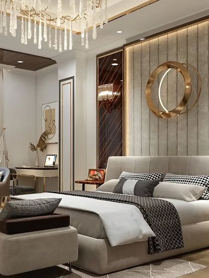 A high-end bedroom design with a tufted wall panel behind the bed and rich, dark wood accents. The space includes a comfortable armchair and a small desk, creating a multi-functional suite.