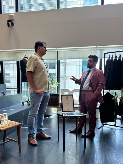 A one-on-one consultation at our BCG trunk show. It's in these conversations that we explore fabric narratives, decode fits, and craft looks that speak beyond trends.